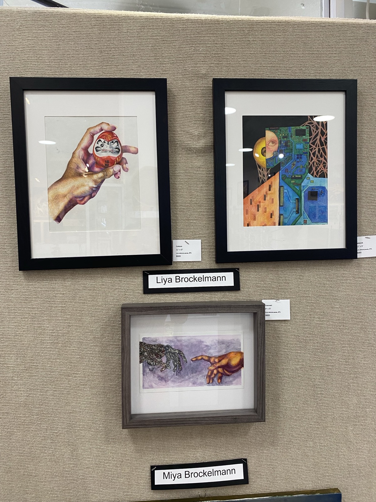 Three framed pieces on display at Gallery 408